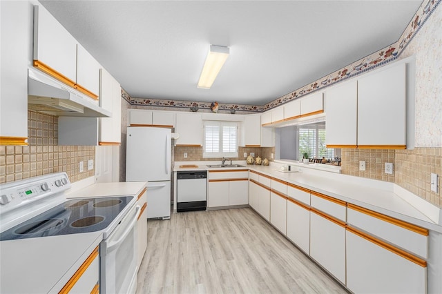 8608 SE 141st Street Rd, Summerfield, FL 34491 - kitchen with white appliances, decorative backsplash, light countertops, and white cabinetry