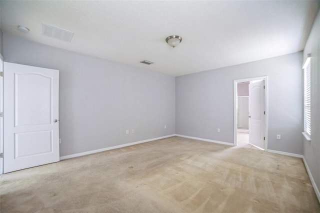 236 Savannah Preserve Loop, Davenport, FL 33837 - unfurnished room with light colored carpet, baseboards, and plenty of natural light