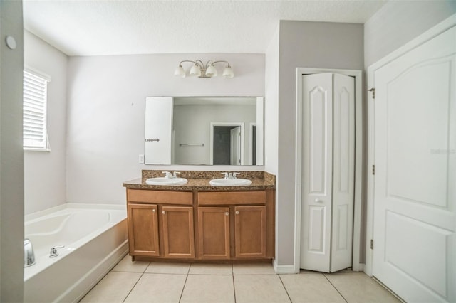 236 Savannah Preserve Loop, Davenport, FL 33837 - full bath featuring a closet, double vanity, tile patterned flooring, and a bath