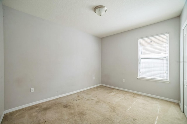 236 Savannah Preserve Loop, Davenport, FL 33837 - empty room featuring light colored carpet and baseboards