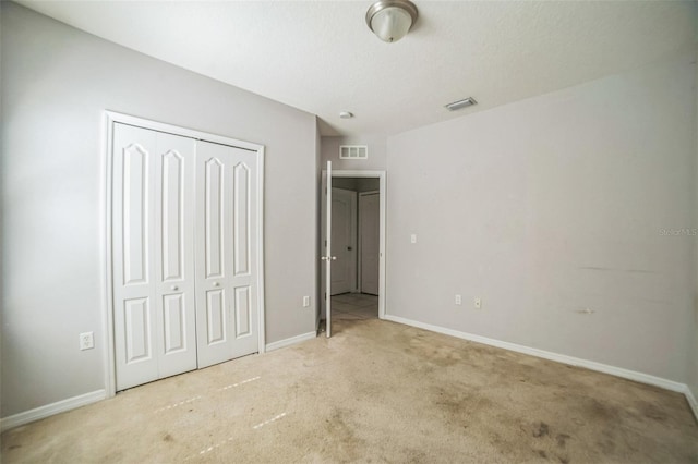 236 Savannah Preserve Loop, Davenport, FL 33837 - unfurnished bedroom featuring carpet flooring, a closet, and baseboards