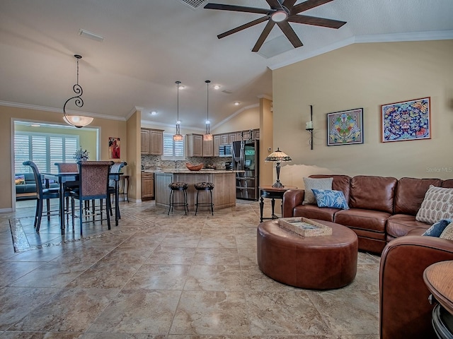 1206 Thompson Ave, The Villages, FL 32162 - living area with lofted ceiling, ceiling fan, and ornamental molding