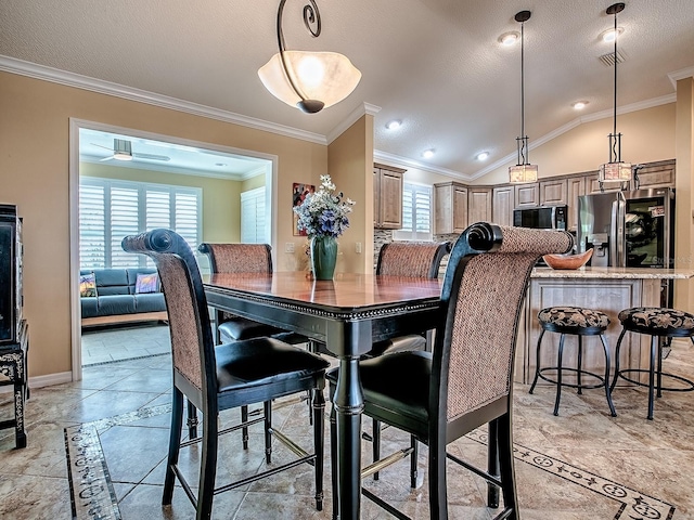 1206 Thompson Ave, The Villages, FL 32162 - dining area featuring plenty of natural light, crown molding, vaulted ceiling, and baseboards
