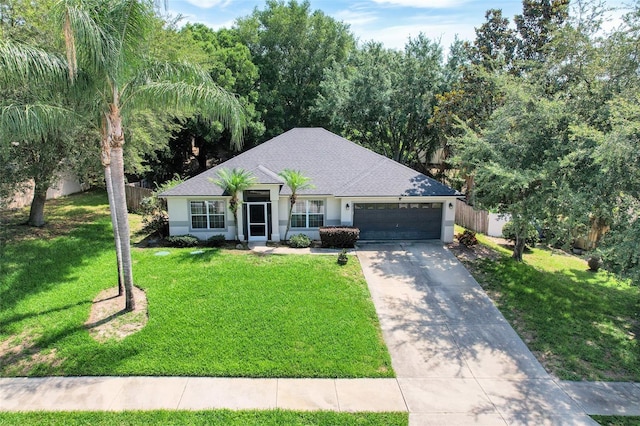 1311 Rain Forest Ln, Minneola, FL 34715 - single story home featuring an attached garage, driveway, stucco siding, and a shingled roof