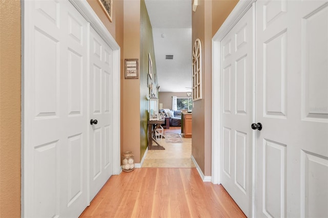 1311 Rain Forest Ln, Minneola, FL 34715 - hall featuring light wood-type flooring and baseboards