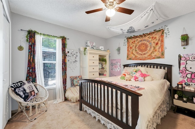 1311 Rain Forest Ln, Minneola, FL 34715 - bedroom featuring carpet floors, a textured ceiling, and ceiling fan