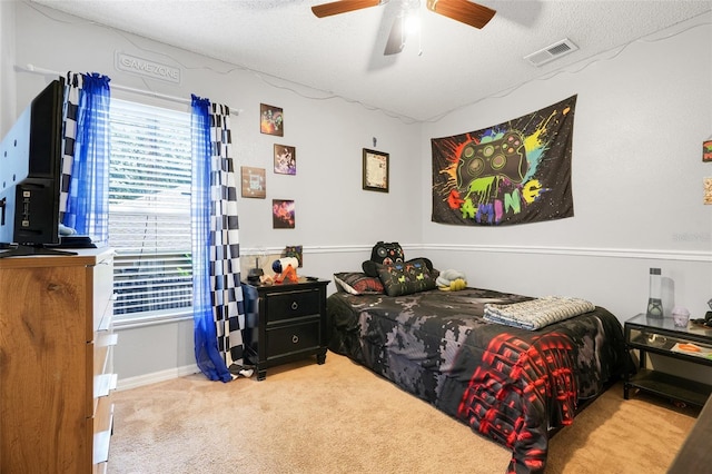 1311 Rain Forest Ln, Minneola, FL 34715 - bedroom featuring carpet, ceiling fan, and a textured ceiling