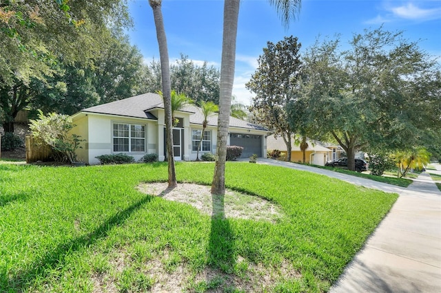 1311 Rain Forest Ln, Minneola, FL 34715 - single story home featuring concrete driveway, an attached garage, stucco siding, and a front lawn