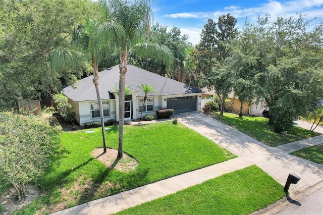 1311 Rain Forest Ln, Minneola, FL 34715 - single story home featuring stucco siding, a garage, concrete driveway, and a shingled roof