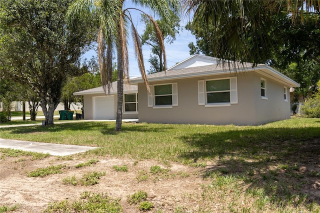 2701 S Dellwood Dr, Eustis, FL 32726 - view of front of property with an attached garage, stucco siding, and a front yard