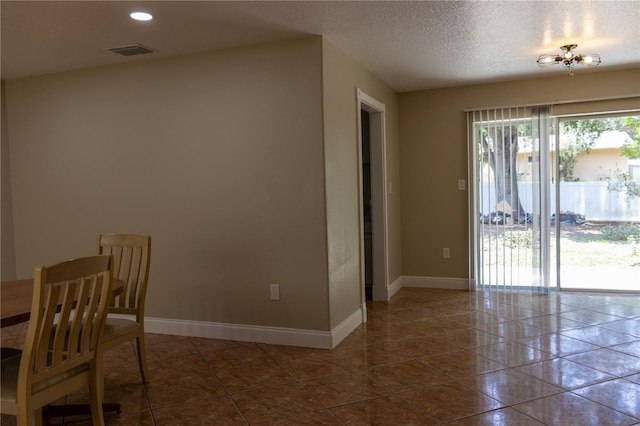 2701 S Dellwood Dr, Eustis, FL 32726 - dining space featuring baseboards, a chandelier, recessed lighting, dark tile patterned flooring, and a textured ceiling