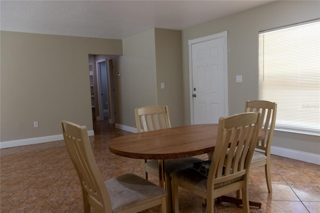 2701 S Dellwood Dr, Eustis, FL 32726 - dining room featuring light tile patterned flooring and baseboards