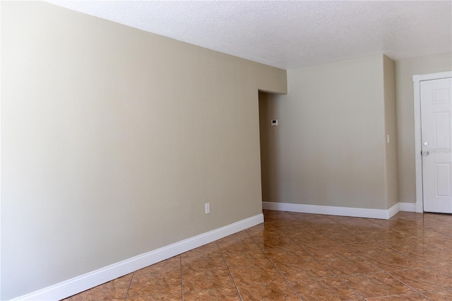 2701 S Dellwood Dr, Eustis, FL 32726 - unfurnished room featuring a textured ceiling and baseboards
