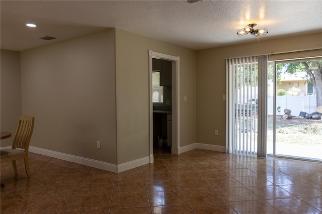 2701 S Dellwood Dr, Eustis, FL 32726 - unfurnished dining area with baseboards, a textured ceiling, tile patterned floors, and recessed lighting