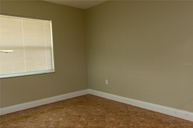2701 S Dellwood Dr, Eustis, FL 32726 - spare room featuring baseboards