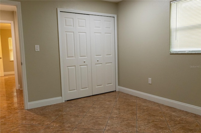 2701 S Dellwood Dr, Eustis, FL 32726 - unfurnished bedroom with a closet and baseboards
