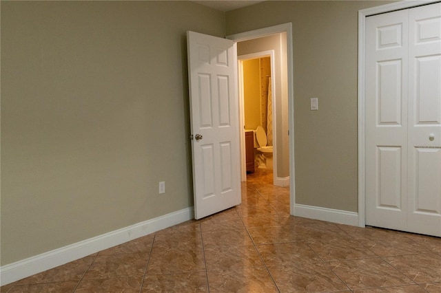 2701 S Dellwood Dr, Eustis, FL 32726 - unfurnished bedroom featuring baseboards and a closet