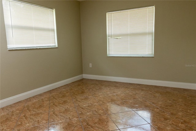 2701 S Dellwood Dr, Eustis, FL 32726 - unfurnished room featuring tile patterned floors and baseboards