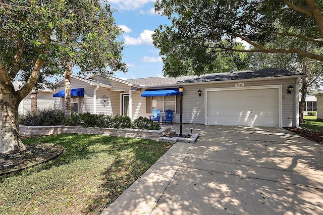 2003 Cordero Ct, The Villages, FL 32159 - single story home with an attached garage, driveway, and a front yard
