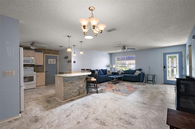 2003 Cordero Ct, The Villages, FL 32159 - living area with a ceiling fan, a chandelier, and a textured ceiling