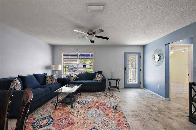 2003 Cordero Ct, The Villages, FL 32159 - living area featuring a ceiling fan and a textured ceiling