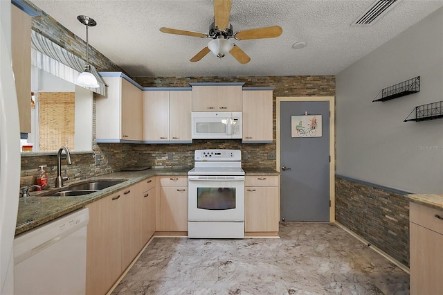 2003 Cordero Ct, The Villages, FL 32159 - kitchen with white appliances, light brown cabinets, a ceiling fan, a textured ceiling, and hanging light fixtures
