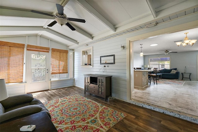 2003 Cordero Ct, The Villages, FL 32159 - living area with a ceiling fan, a chandelier, wood walls, and wood finished floors