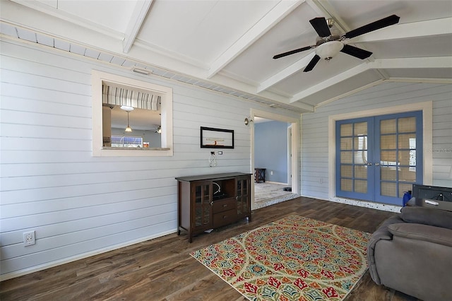 2003 Cordero Ct, The Villages, FL 32159 - living room featuring french doors, wood finished floors, wood walls, a ceiling fan, and plenty of natural light