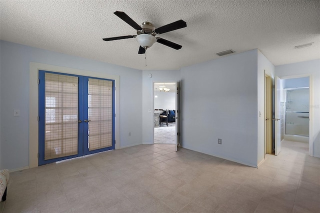2003 Cordero Ct, The Villages, FL 32159 - spare room with french doors, a ceiling fan, and a textured ceiling