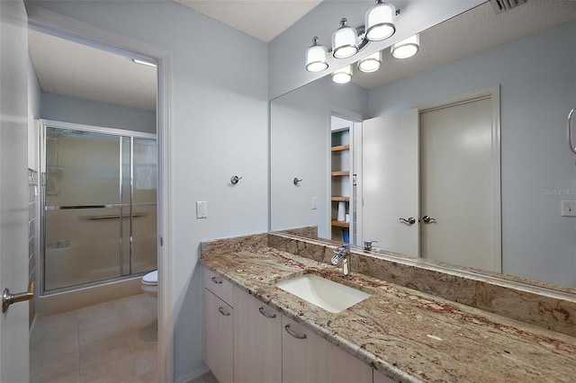 2003 Cordero Ct, The Villages, FL 32159 - full bathroom with vanity, a stall shower, and tile patterned floors