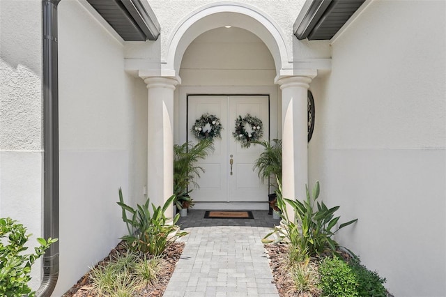 9307 San Jose Blvd, Howey In The Hills, FL 34737 - property entrance with stucco siding
