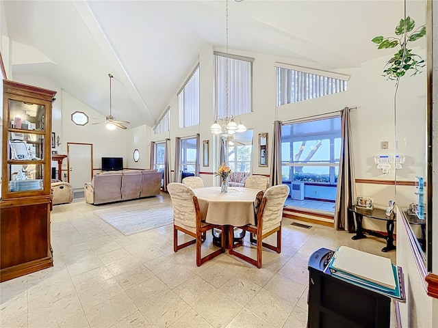 1107 Northshore Dr, Eustis, FL 32726 - dining room with a ceiling fan, high vaulted ceiling, and a chandelier