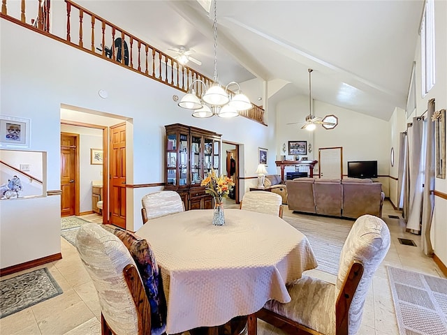 1107 Northshore Dr, Eustis, FL 32726 - dining space featuring a ceiling fan, high vaulted ceiling, light tile patterned floors, baseboards, and beam ceiling
