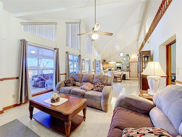 1107 Northshore Dr, Eustis, FL 32726 - living room featuring high vaulted ceiling, ceiling fan, and baseboards