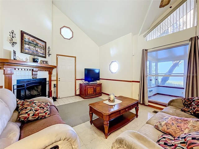 1107 Northshore Dr, Eustis, FL 32726 - living room with high vaulted ceiling, a fireplace, and tile patterned flooring