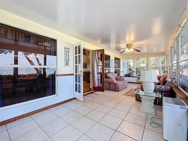 1107 Northshore Dr, Eustis, FL 32726 - sunroom featuring tile patterned floors, french doors, and baseboards