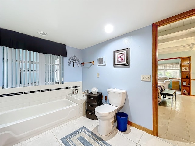 1107 Northshore Dr, Eustis, FL 32726 - bathroom with a bath, toilet, tile patterned flooring, baseboards, and recessed lighting