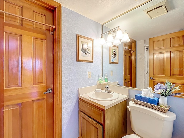 1107 Northshore Dr, Eustis, FL 32726 - bathroom with vanity, toilet, and a textured wall