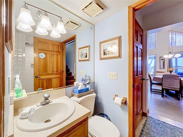 1107 Northshore Dr, Eustis, FL 32726 - bathroom with a chandelier, toilet, tile patterned flooring, and vanity
