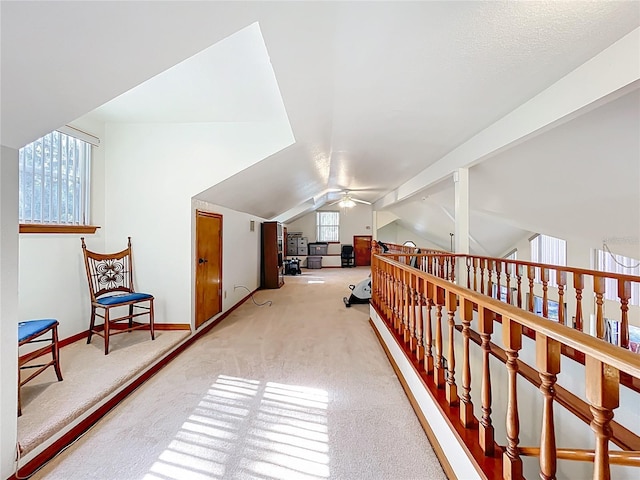 1107 Northshore Dr, Eustis, FL 32726 - hallway featuring carpet flooring, lofted ceiling, and baseboards