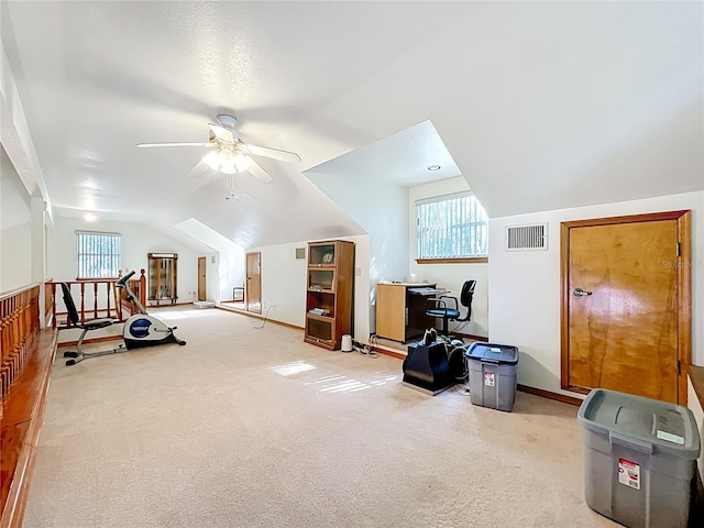 1107 Northshore Dr, Eustis, FL 32726 - additional living space with vaulted ceiling, ceiling fan, healthy amount of natural light, and carpet