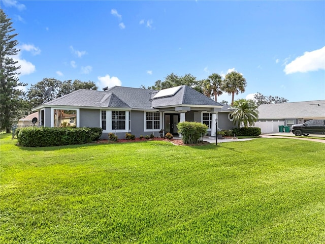 2024 Meadowside Dr, Eustis, FL 32726 - single story home with stucco siding, a front lawn, french doors, and roof mounted solar panels
