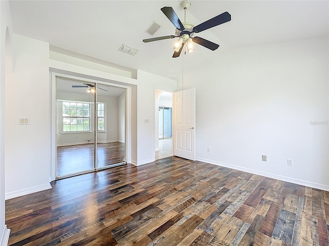 2024 Meadowside Dr, Eustis, FL 32726 - unfurnished bedroom with wood-type flooring, a closet, ceiling fan, and vaulted ceiling