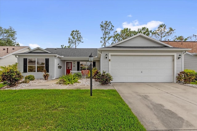 single story home featuring concrete driveway, a front yard, an attached garage, and a porch