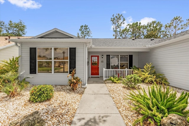 property entrance featuring covered porch