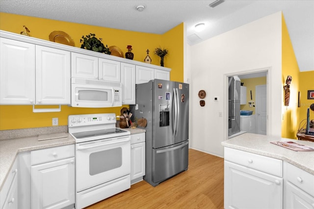 kitchen featuring white appliances, light wood-type flooring, white cabinets, and light countertops