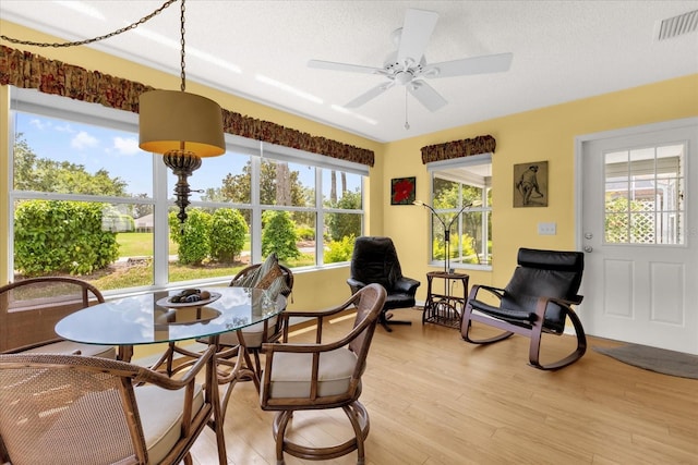 sunroom / solarium with healthy amount of natural light and wood finished floors