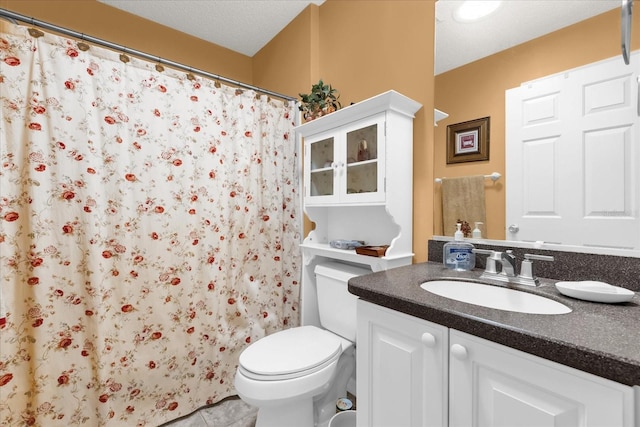 full bath featuring toilet, vanity, tile patterned flooring, and a shower with shower curtain