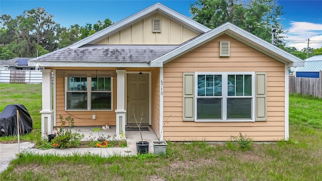 6710 Winkles St, Coleman, FL 33521 - bungalow-style home with board and batten siding and a shingled roof