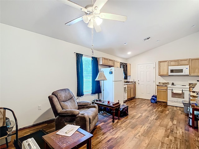 6710 Winkles St, Coleman, FL 33521 - living area with vaulted ceiling, ceiling fan, dark wood-type flooring, and recessed lighting